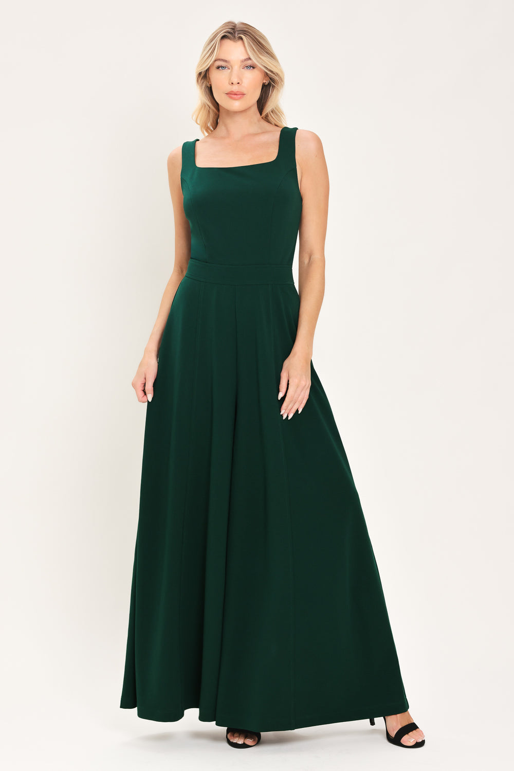 Woman wearing a sleeveless square neck solid hunter green wide-leg jumpsuit | Flying Tomato