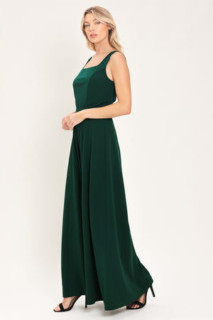 Woman wearing a sleeveless square neck solid hunter green wide-leg jumpsuit | Flying Tomato