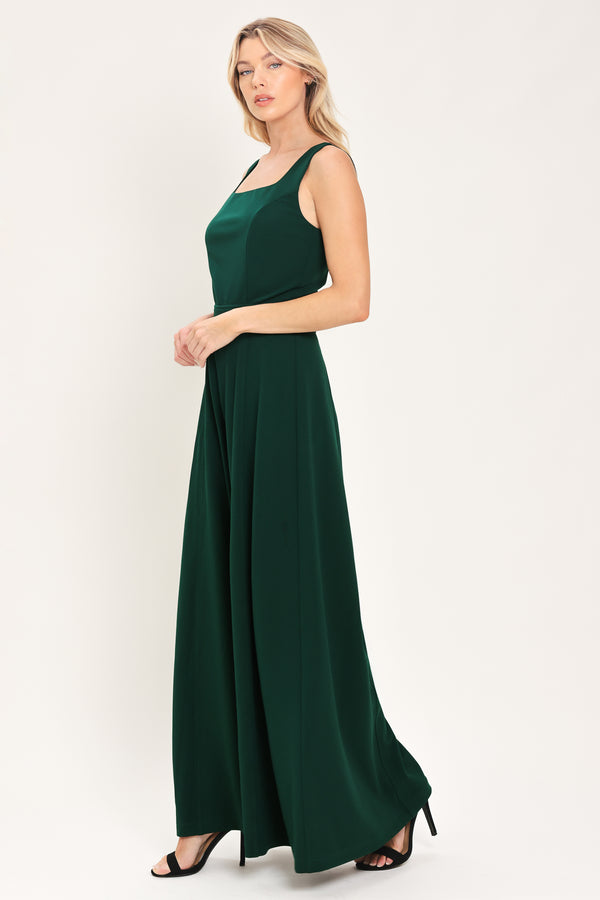 Woman wearing a sleeveless square neck solid hunter green wide-leg jumpsuit | Flying Tomato