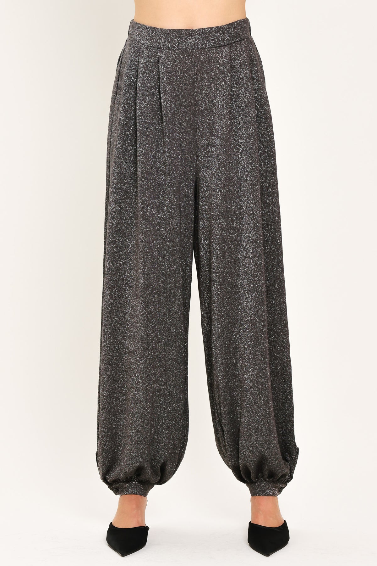 A pair of dark gray metallic wide-leg harem pants with elastic cuffs, shown on a model | Flying Tomato