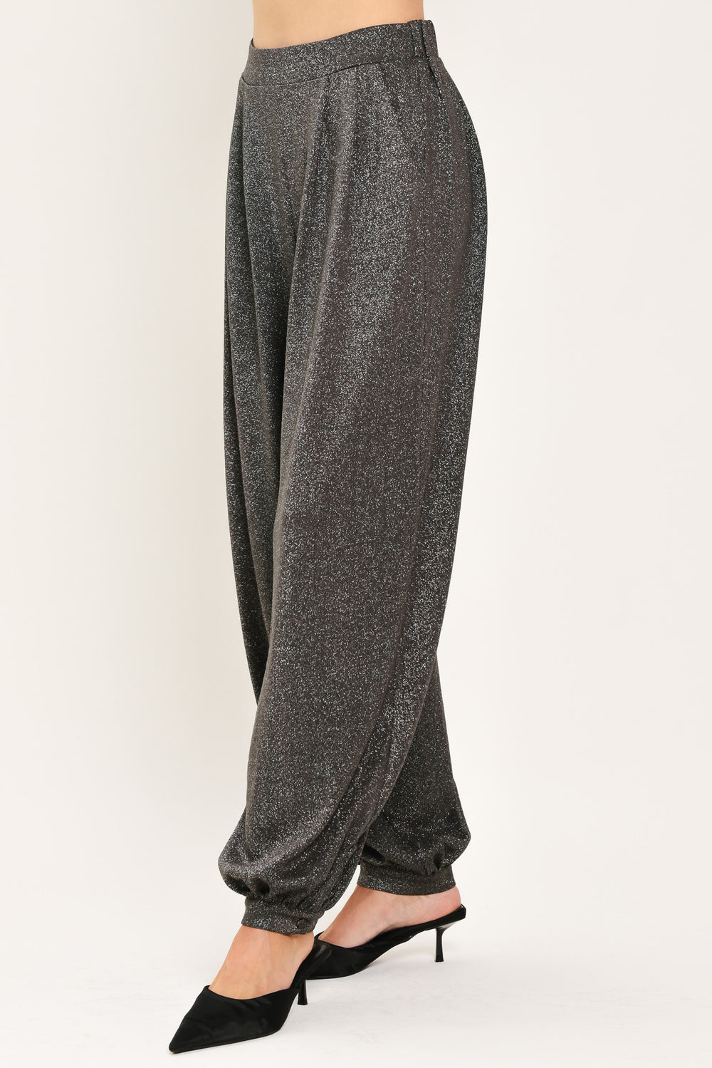 A pair of dark gray metallic wide-leg harem pants with elastic cuffs, shown on a model | Flying Tomato