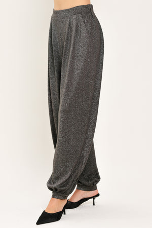 A pair of dark gray metallic wide-leg harem pants with elastic cuffs, shown on a model | Flying Tomato