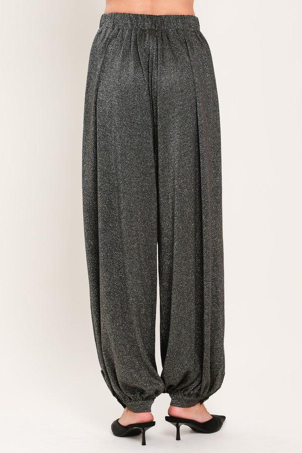 A pair of dark gray metallic wide-leg harem pants with elastic cuffs, shown on a model | Flying Tomato