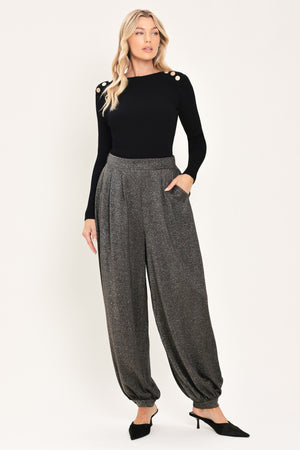A pair of dark gray metallic wide-leg harem pants with elastic cuffs, shown on a model | Flying Tomato