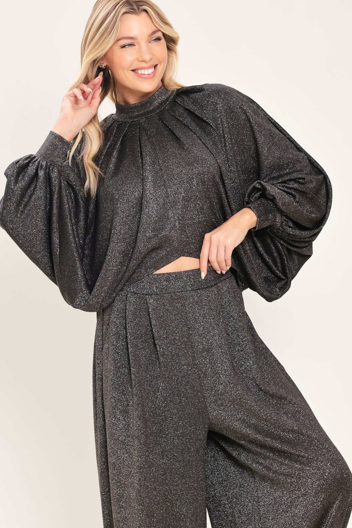 A pair of dark gray metallic wide-leg harem pants with elastic cuffs, shown on a model | Flying Tomato