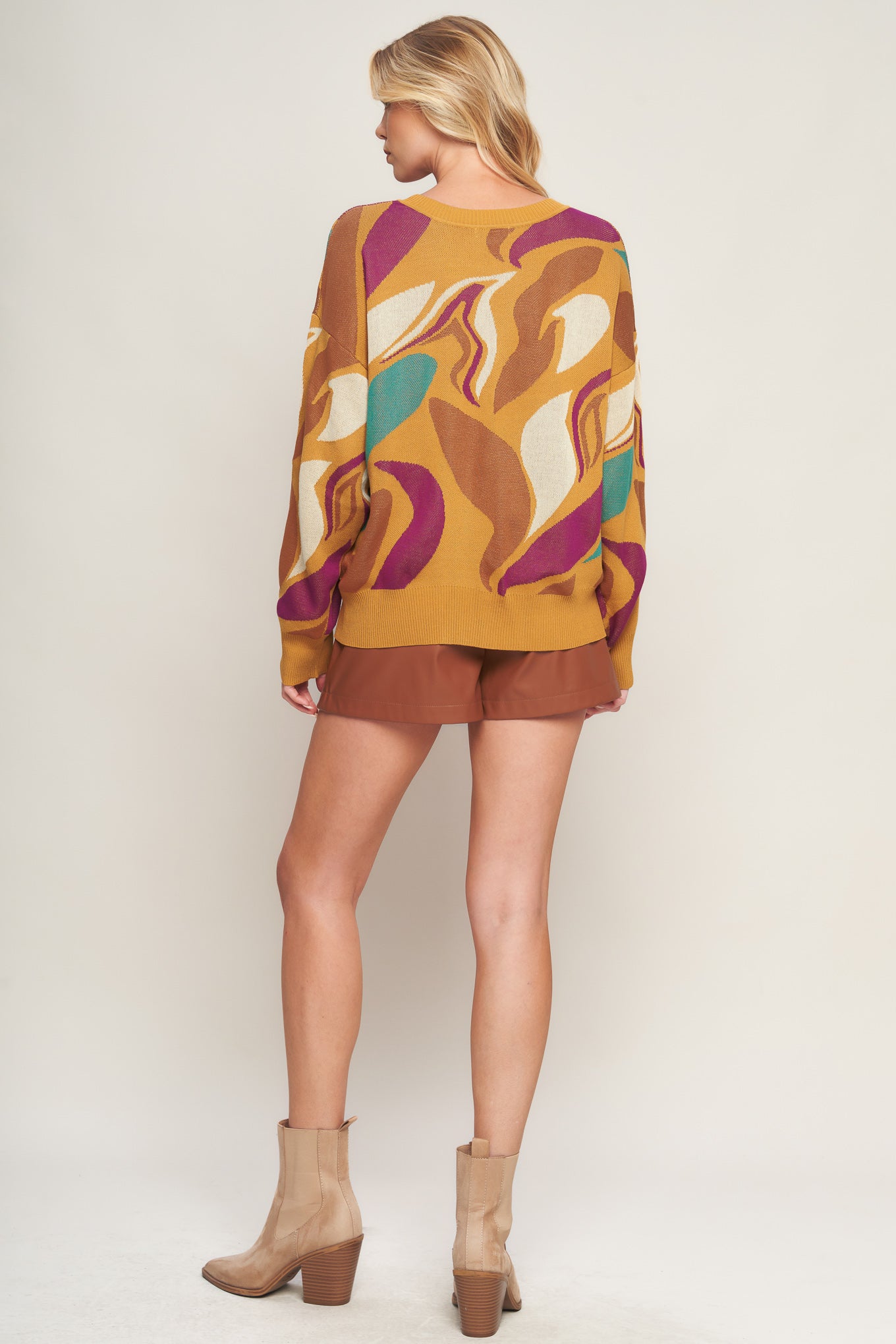 This READY TO ADORE SWEATER TOP is the perfect combination of comfort and style. It features a classic jacquard graphic and a bold crew neck that's ideal for any look. The drop shoulder and long sleeve provide a comfortable fit, making it perfect for casual occasions.