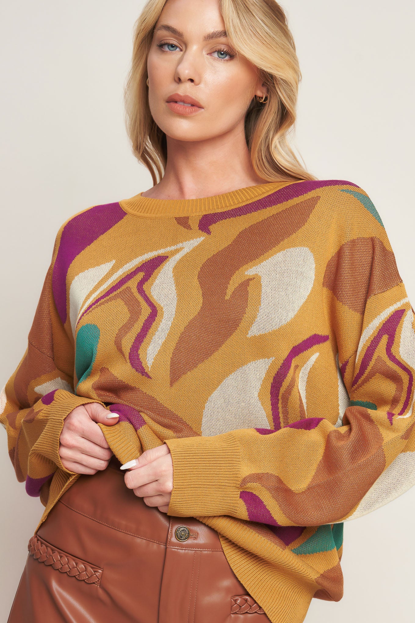 This READY TO ADORE SWEATER TOP is the perfect combination of comfort and style. It features a classic jacquard graphic and a bold crew neck that's ideal for any look. The drop shoulder and long sleeve provide a comfortable fit, making it perfect for casual occasions.