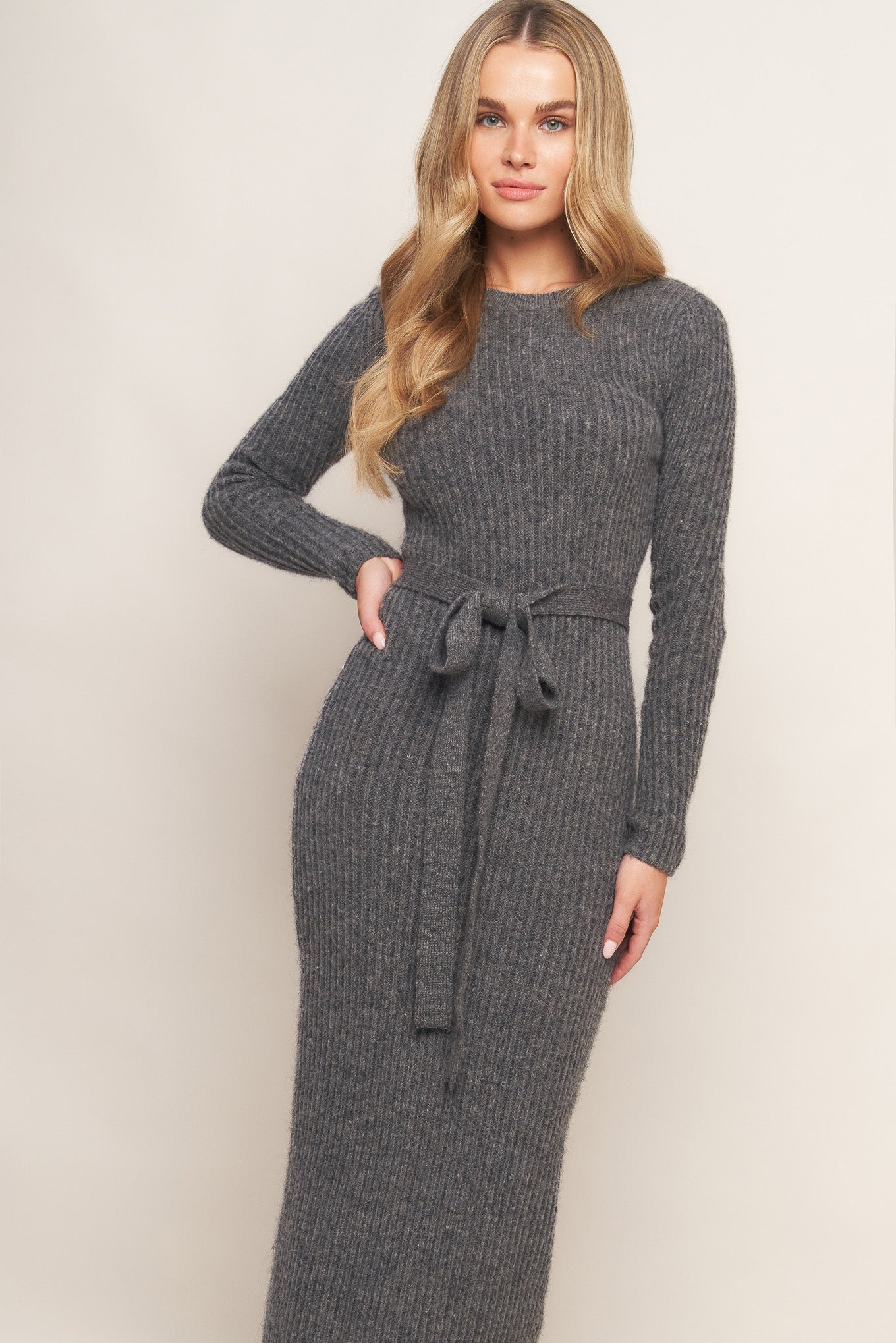 A sweater knit midi with long sleeve and self sash tie
