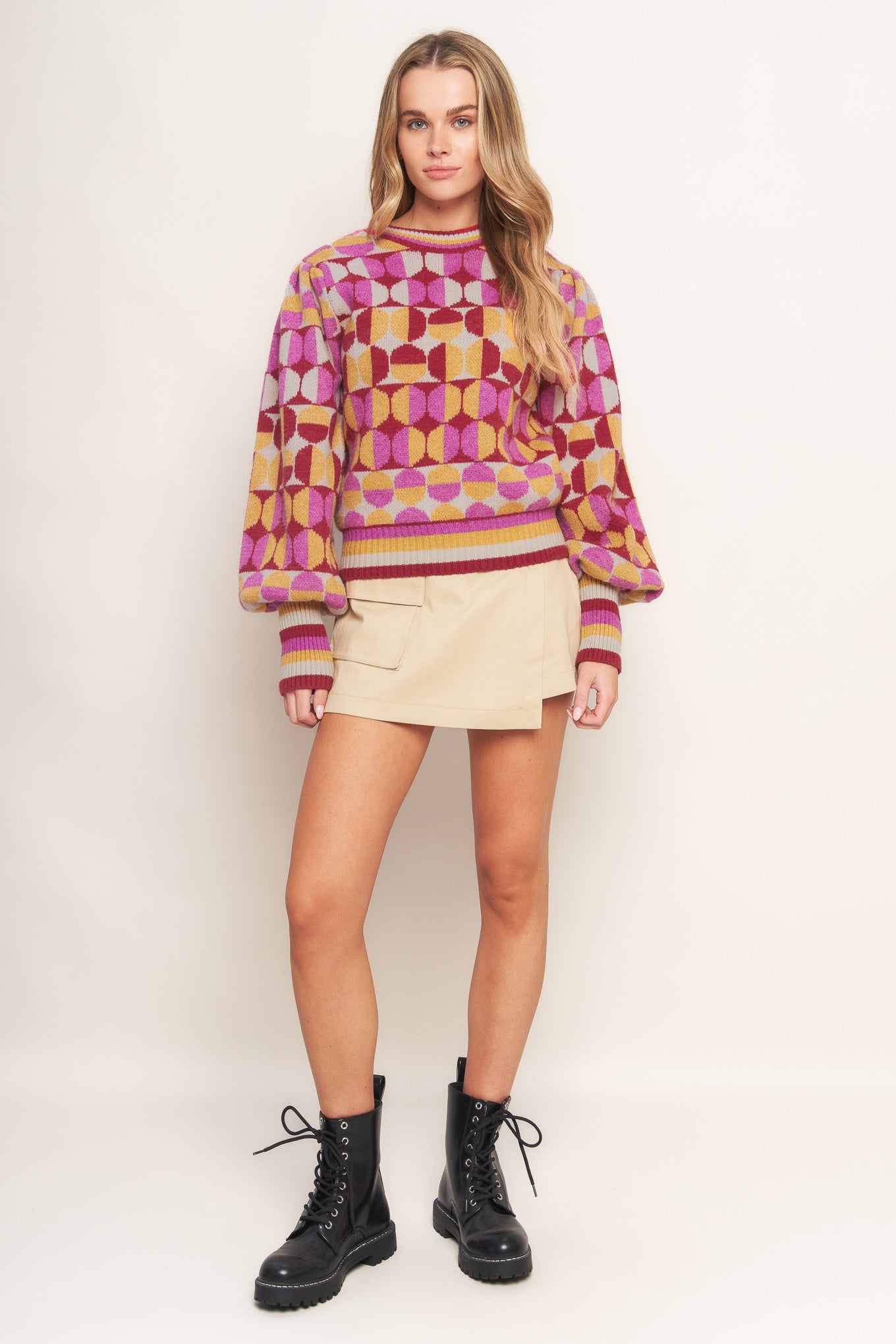 A jacquard knit sweater with a high neckline and long-sleeve