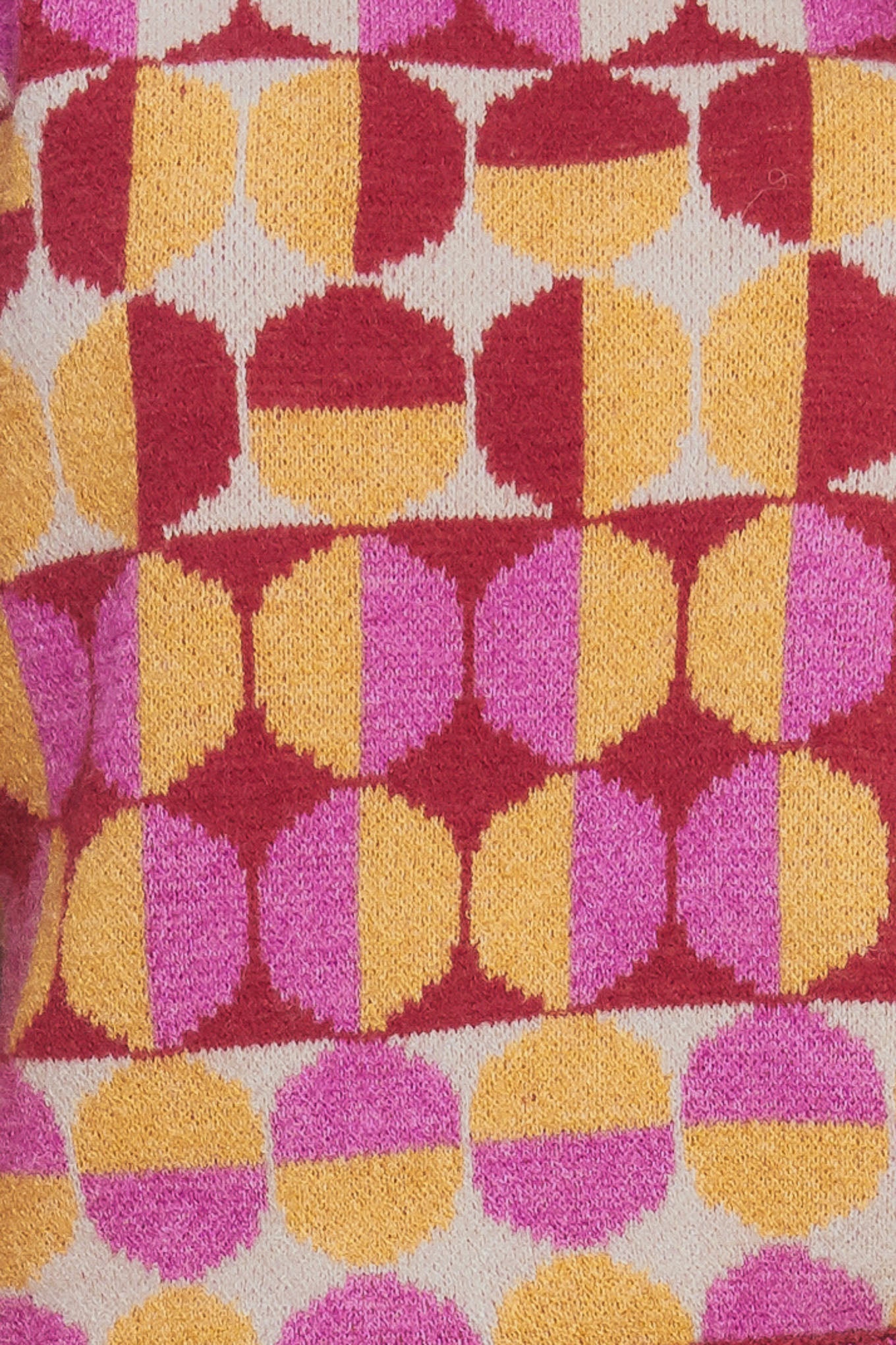 A jacquard knit sweater with a high neckline and long-sleeve