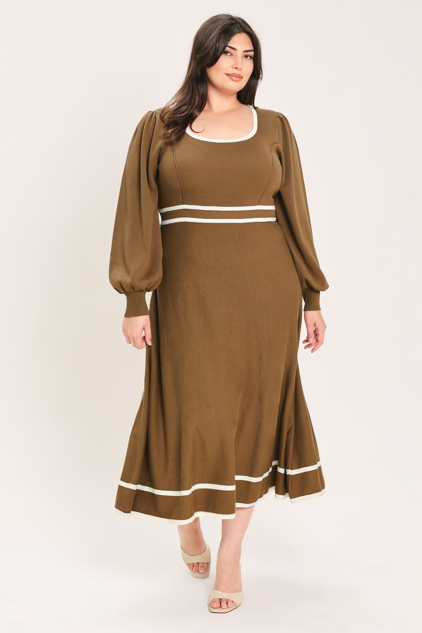 A woman modeling a brown midi dress with white trim details, including a square neckline, sleeve cuffs, a horizontal waist stripe, and a hemline | Flying tomato Curve