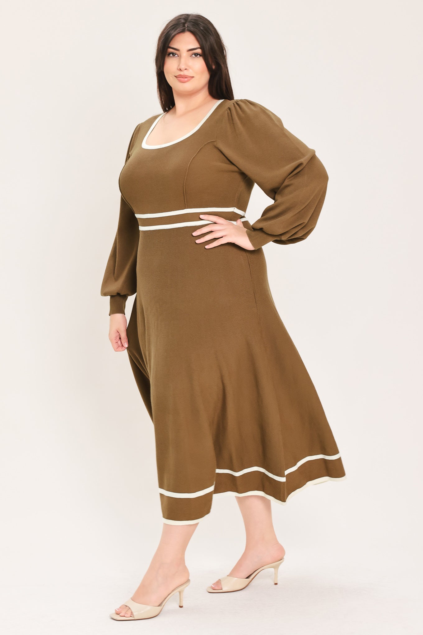 A woman modeling a brown midi dress with white trim details, including a square neckline, sleeve cuffs, a horizontal waist stripe, and a hemline | Flying tomato Curve
