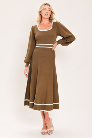 A woman modeling a brown midi dress with white trim details, including a square neckline, sleeve cuffs, a horizontal waist stripe, and a hemline | Flying tomato