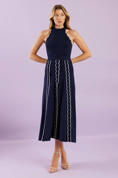 A solid sweater knit midi dress featuring halter neckline and back neck button closure


Details:

Self : 75% Viscose 25% Nylon

Size &amp; Fit

- Model is 5`8" And Wearing Size Small
- Measurements Taken From Size Small
- Approx. Length: 55"