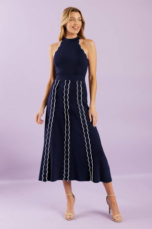 A solid sweater knit midi dress featuring halter neckline and back neck button closure


Details:

Self : 75% Viscose 25% Nylon

Size &amp; Fit

- Model is 5`8" And Wearing Size Small
- Measurements Taken From Size Small
- Approx. Length: 55"