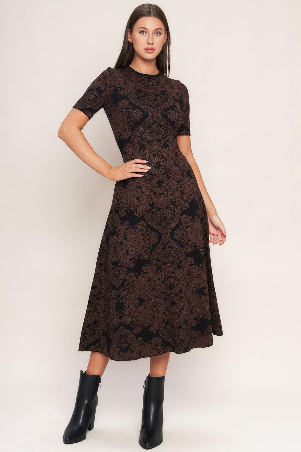 A jacquard sweater midi dress featuring crew neckline, short sleeve, circle skirt and back neck zipper closure