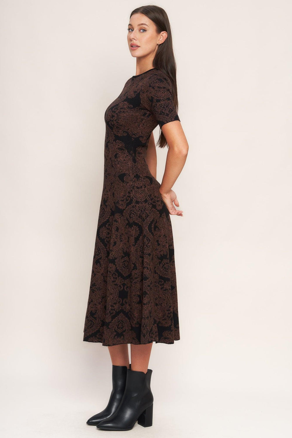 A jacquard sweater midi dress featuring crew neckline, short sleeve, circle skirt and back neck zipper closure