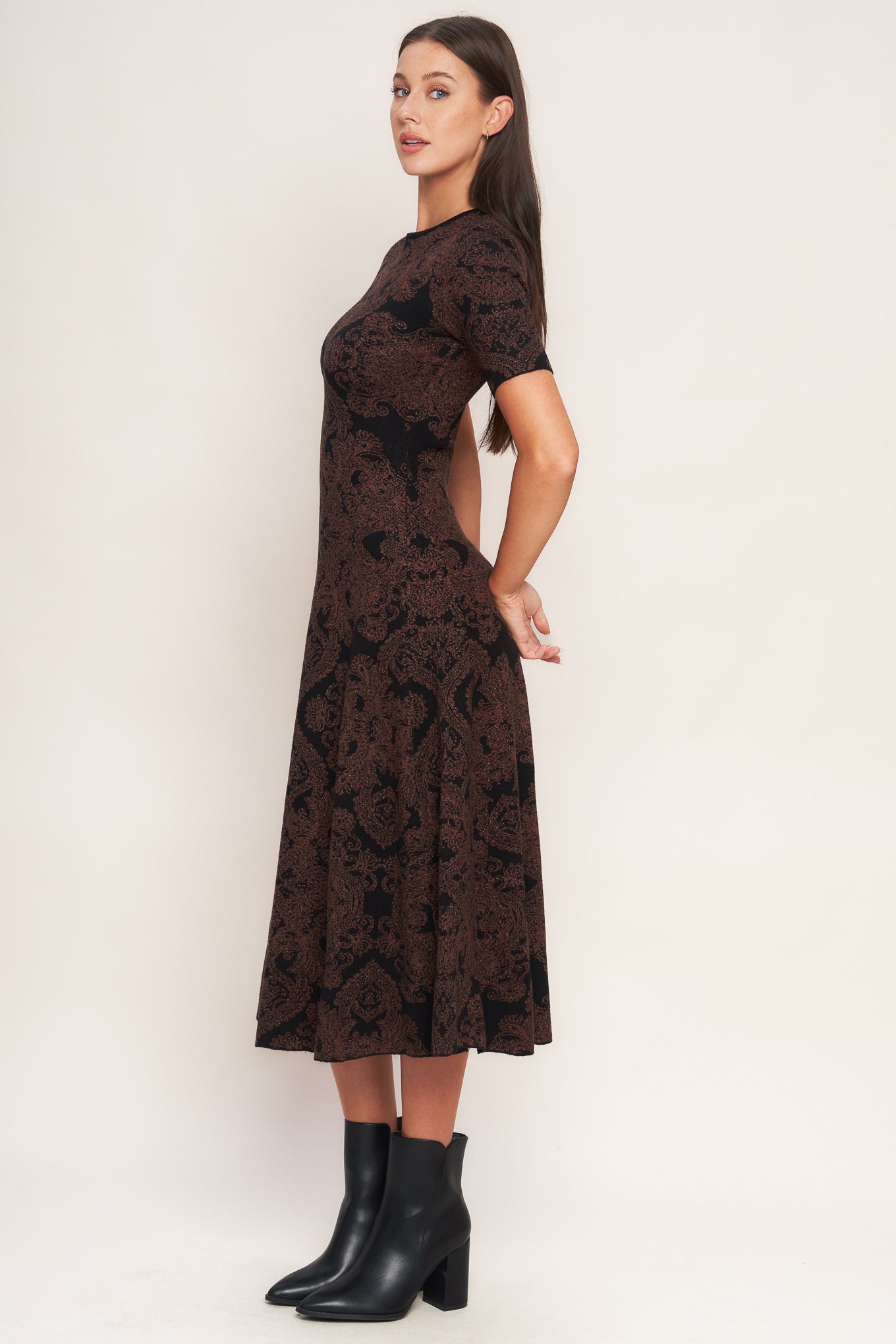 A jacquard sweater midi dress featuring crew neckline, short sleeve, circle skirt and back neck zipper closure