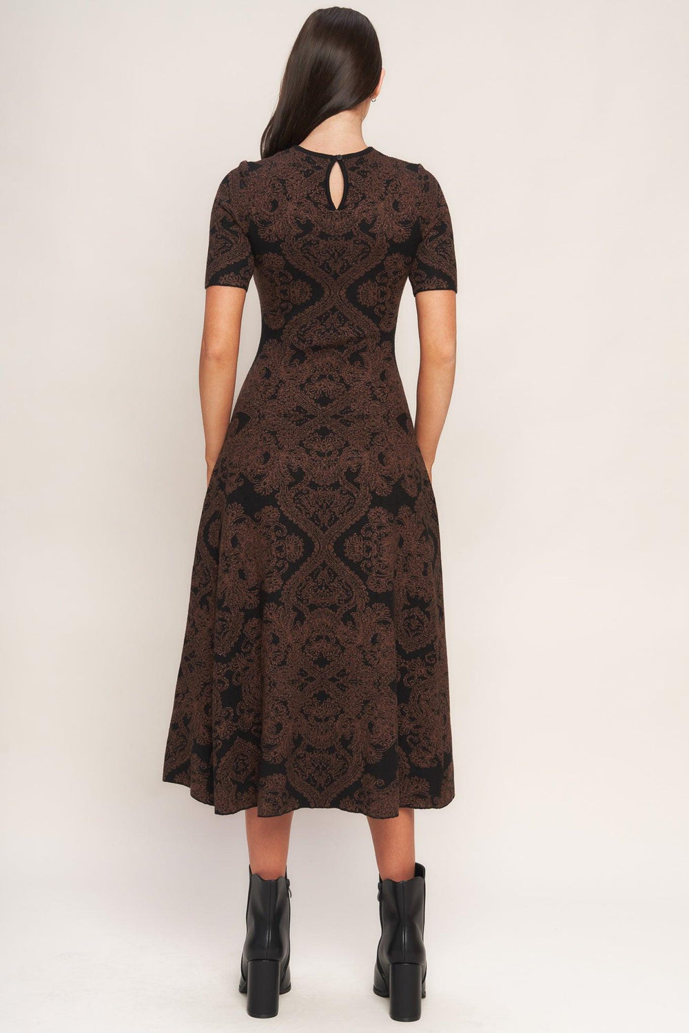 A jacquard sweater midi dress featuring crew neckline, short sleeve, circle skirt and back neck zipper closure