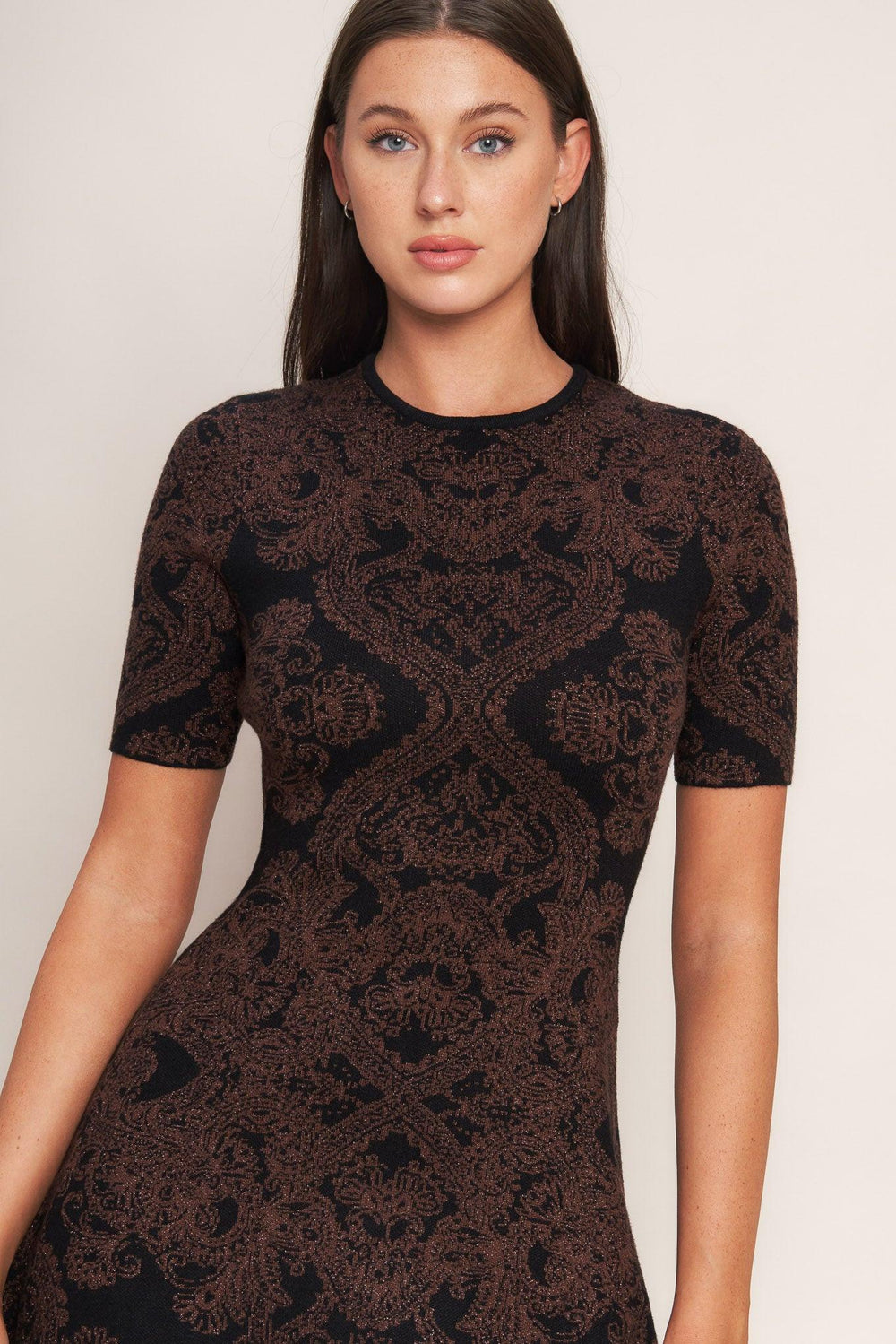 A jacquard sweater midi dress featuring crew neckline, short sleeve, circle skirt and back neck zipper closure