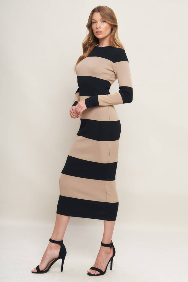 Woman wearing a black and beige long sleeve striped midi dress | Flying Tomato