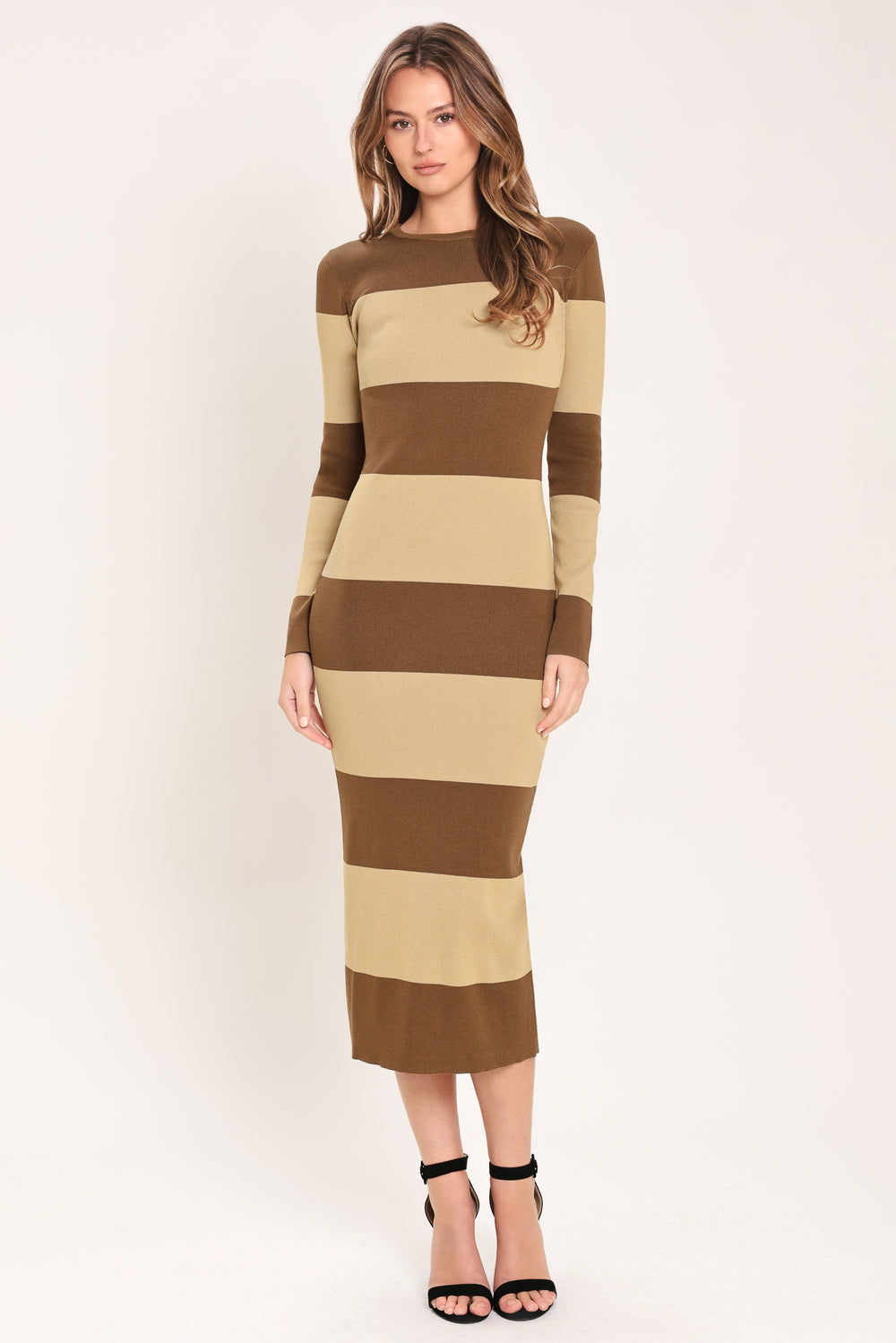 Woman wearing a brown and beige long sleeve striped midi dress | Flying Tomato
