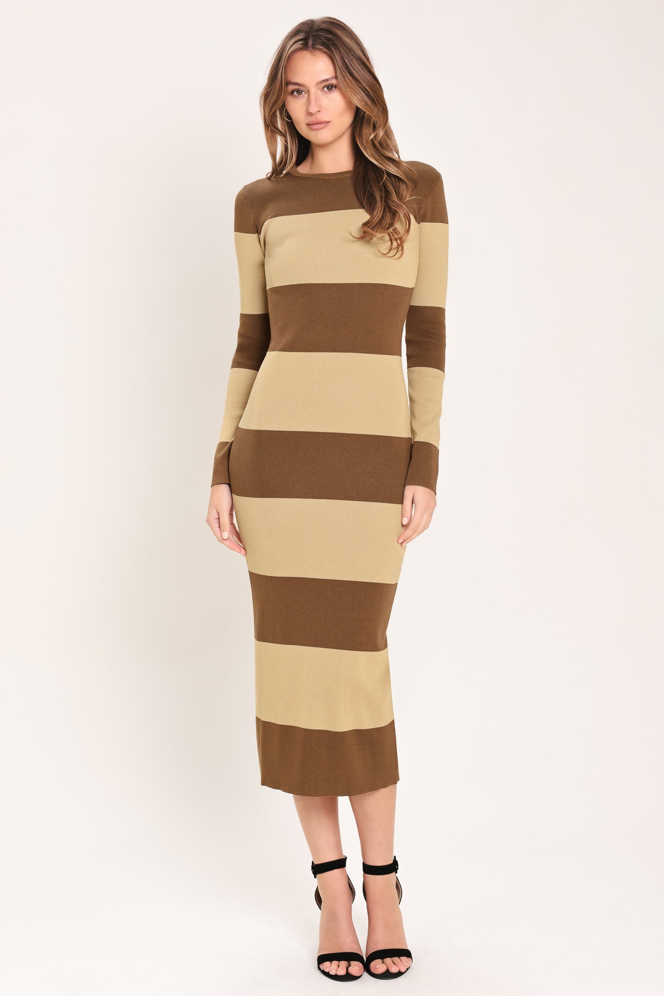 Woman wearing a brown and beige long sleeve striped midi dress | Flying Tomato
