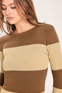 
Woman wearing a brown and beige long sleeve striped midi dress | Flying Tomato
