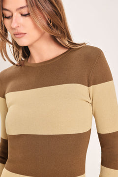 
Woman wearing a brown and beige long sleeve striped midi dress | Flying Tomato
