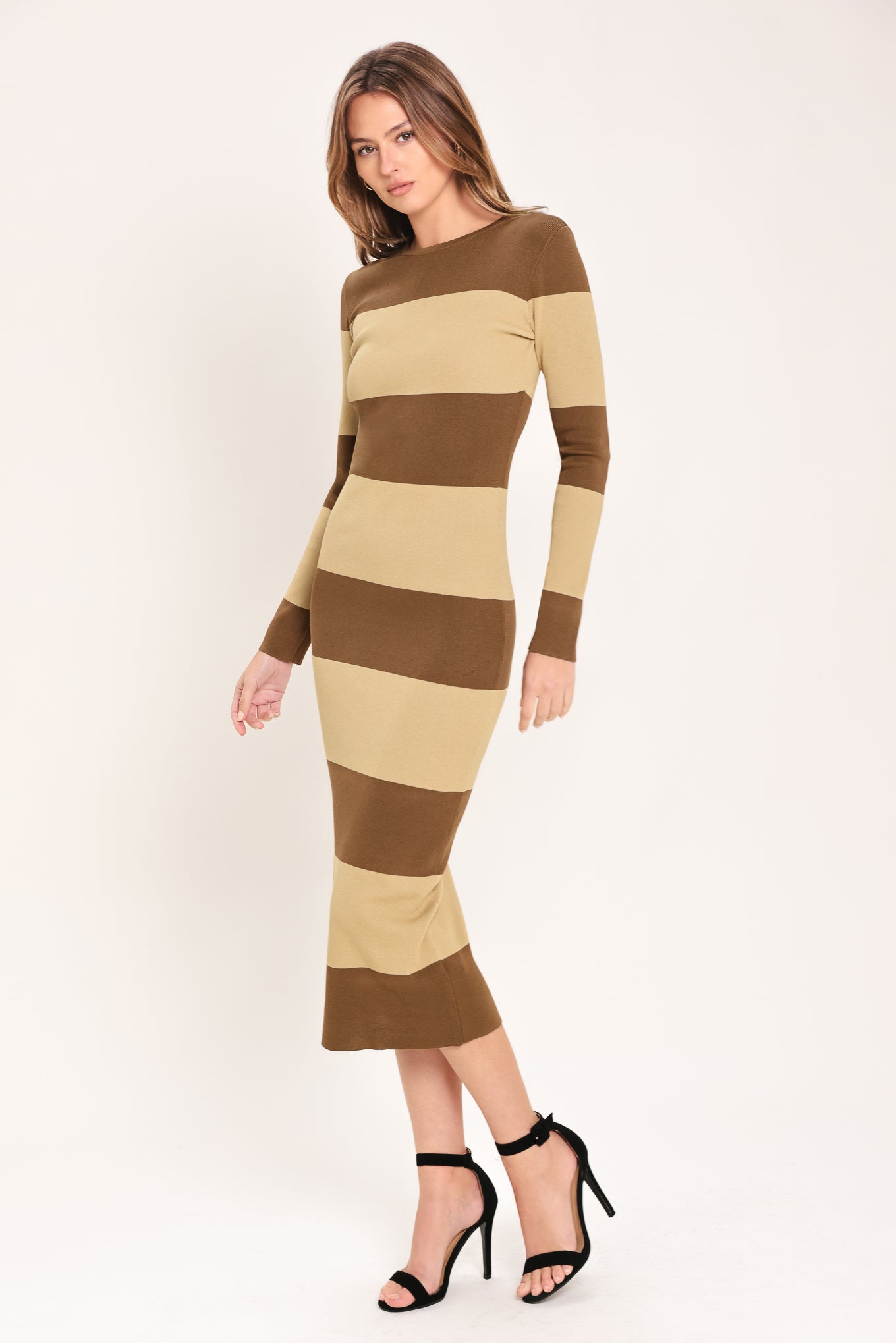 
Woman wearing a brown and beige long sleeve striped midi dress | Flying Tomato