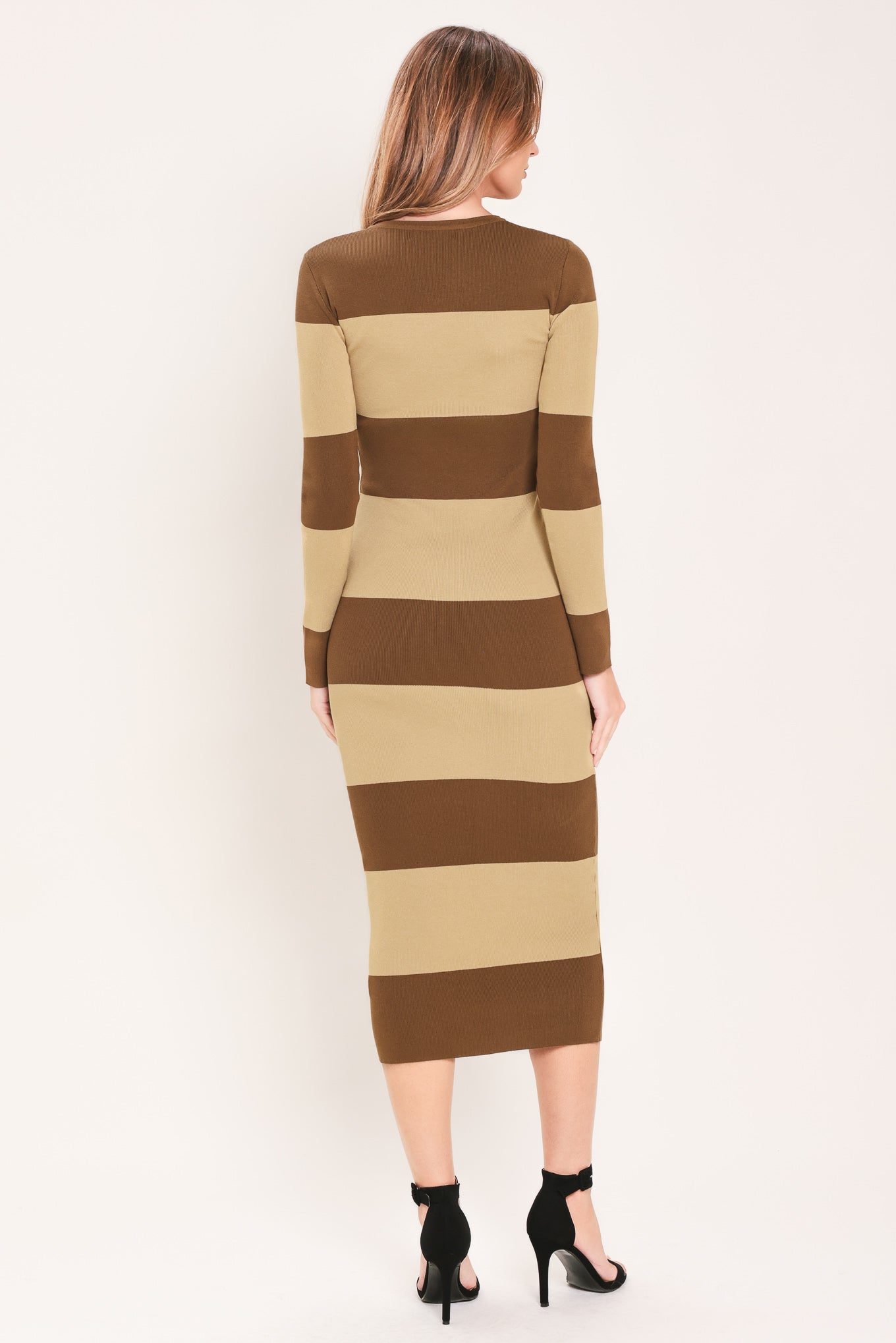 
Woman wearing a brown and beige long sleeve striped midi dress | Flying Tomato

