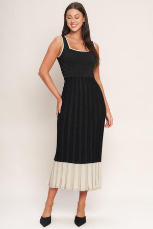 A sweater knit midi dress featuring square neckline, sleeveless and body contouring