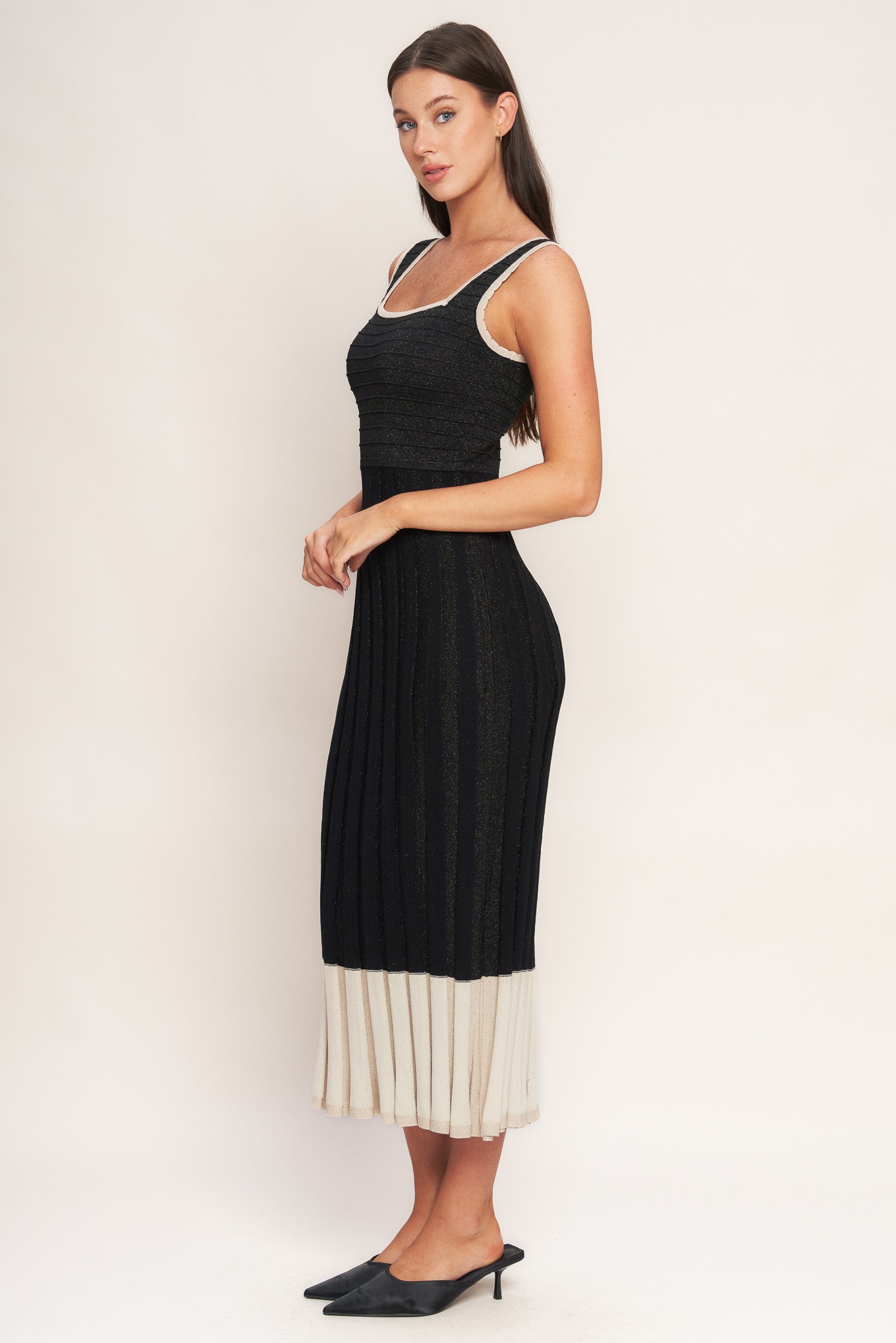 A sweater knit midi dress featuring square neckline, sleeveless and body contouring