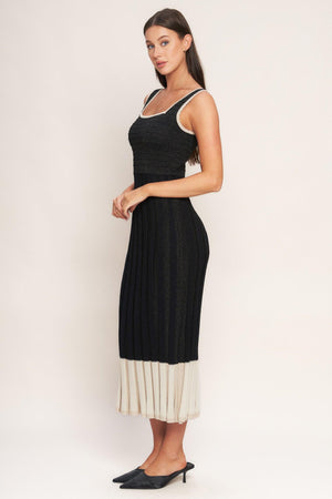 A sweater knit midi dress featuring square neckline, sleeveless and body contouring