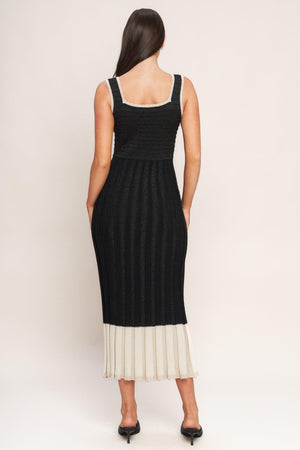 A sweater knit midi dress featuring square neckline, sleeveless and body contouring