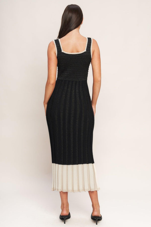 A sweater knit midi dress featuring square neckline, sleeveless and body contouring
