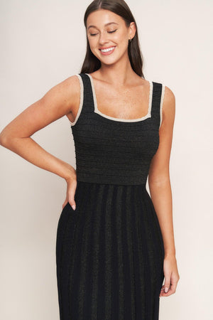 A sweater knit midi dress featuring square neckline, sleeveless and body contouring