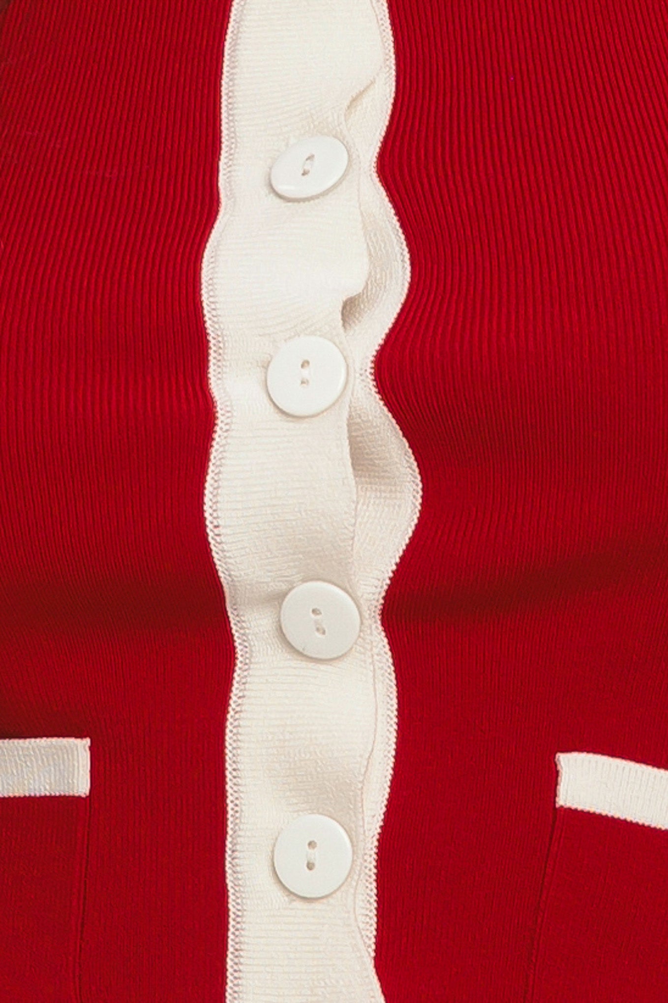 A color blocked sweater knit top with round neckline, sleeveless, front pockets and button down

Details:

Self: 78% Viscose 22% Nylon

Size & Fit

-Model is 58 And Wearing Size Small
-Measurements Taken From Size Small
-Approx. Length: 18"