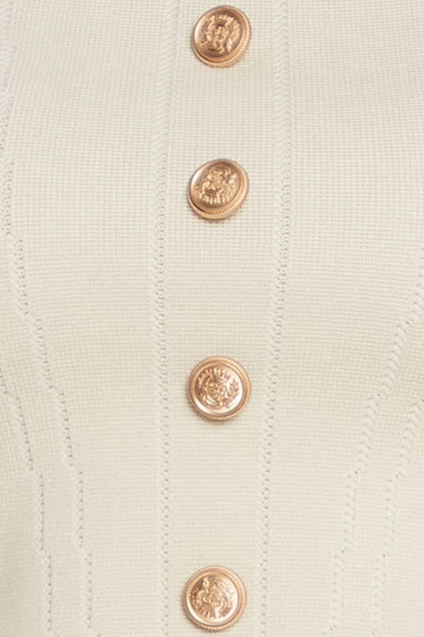 A sweater knit top featuring square neckline, cap sleeve and front button detail