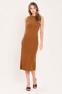 A woman wearing a sleeveless, high-neck, sweater knot bodycon midi dress in a warm camel brown color | Flying Tomato