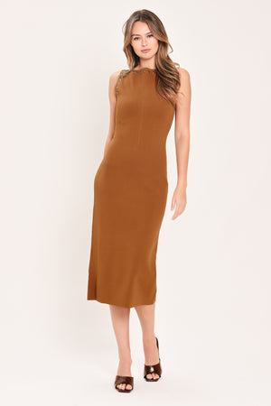A woman wearing a sleeveless, high-neck, sweater knot bodycon midi dress in a warm camel brown color | Flying Tomato