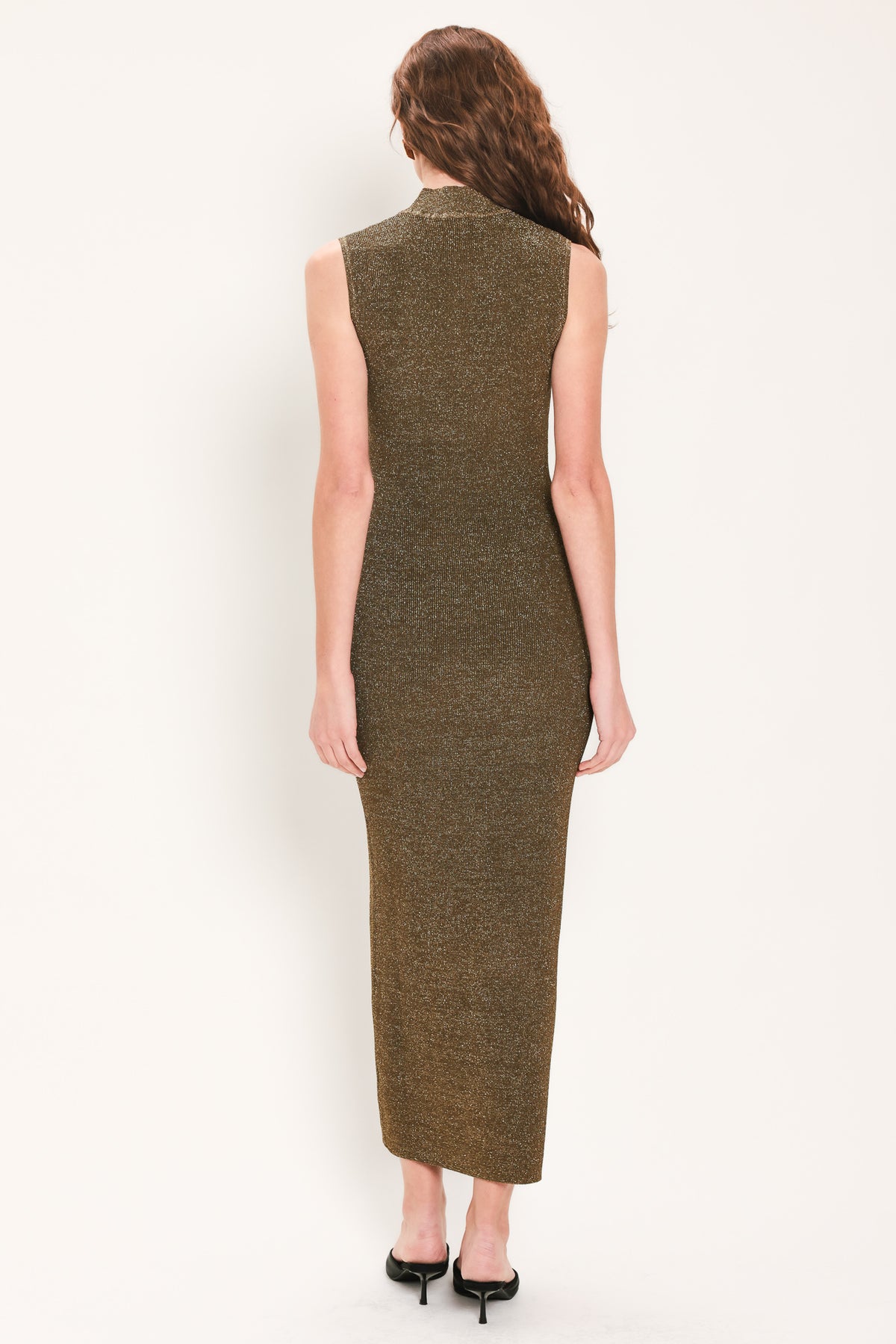 Woman wearing a brown shimmery knitted, sleeveless midi dress with small vertical cut-outs near the chest | Flying Tomato