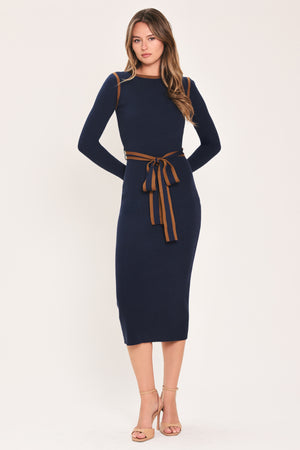 A woman modeling a navy blue long-sleeve midi dress with brown trim details on the shoulders and a matching brown tie belt at the waist | Flying Tomato