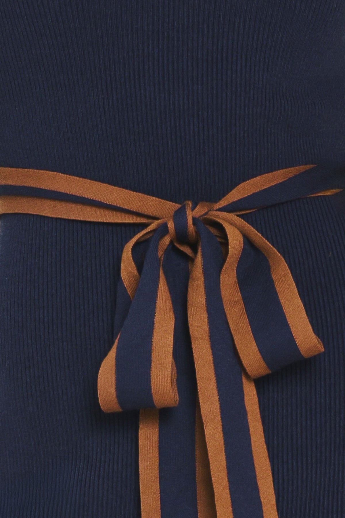 A woman modeling a navy blue long-sleeve midi dress with brown trim details on the shoulders and a matching brown tie belt at the waist | Flying Tomato