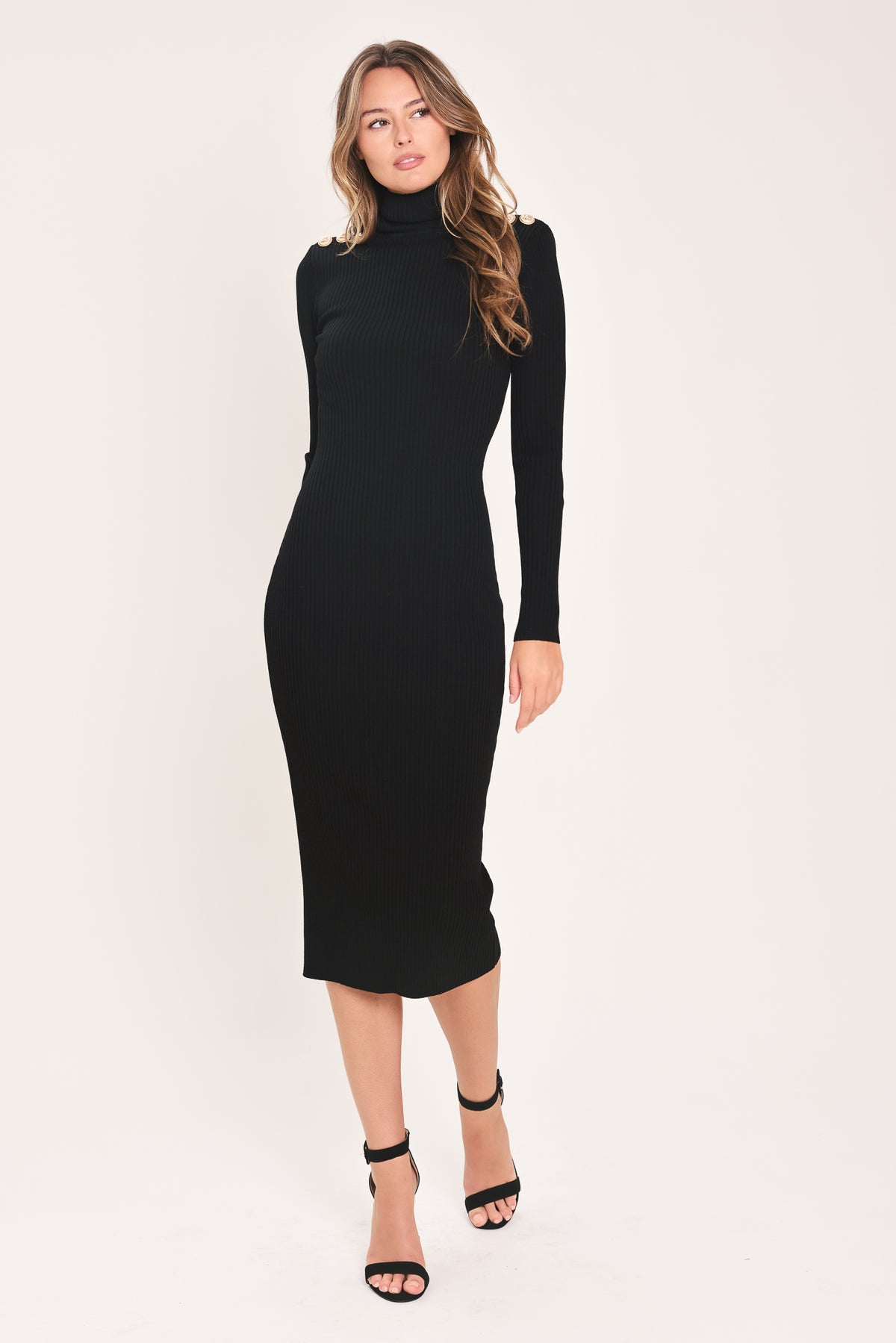 A woman modeling a black long-sleeve mock neck midi dress | Flying Tomato