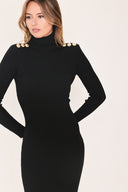 A woman modeling a black long-sleeve mock neck midi dress | Flying Tomato