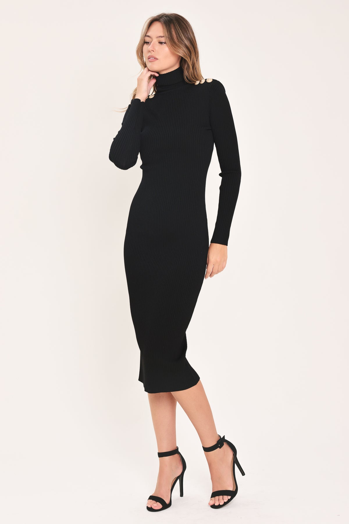 A woman modeling a black long-sleeve mock neck midi dress | Flying Tomato