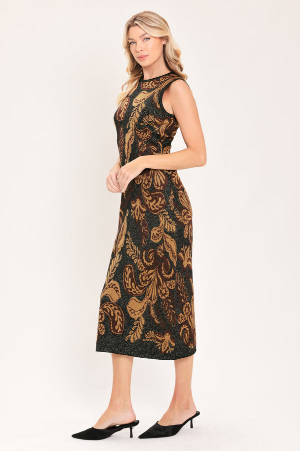 A woman modeling a sleeveless midi dress with a black base and an intricate gold metallic botanical and scroll pattern | Flying Tomato