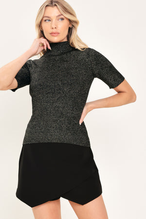 A woman modeling a short-sleeve ribbed knit mock neck black metallic top | Flying Tomato