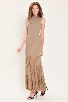 Woman wearing a sleeveless mock neck beige/gold metallic maxi dress with lace tiered skirt starting at the thighs | Flying Tomato